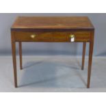 A 20th century mahogany writing table, with cross-banded top with leather skiver above two short