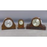 An Edwardian inlaid mahogany mantel clock and 2 oak cased clocks