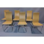 A set of 6 contemporary chrome and leather dining chairs