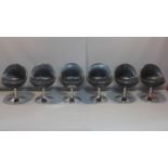 A set of 6 black leather and chrome swivel chairs, H.75cm