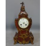 A late 19th century French mantle clock by Maple & Co. Ltd, decorated with ormolu mounts, the