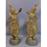 A pair of Siamese gilt wood and mirror inset deities, (arms loose) H.104cm