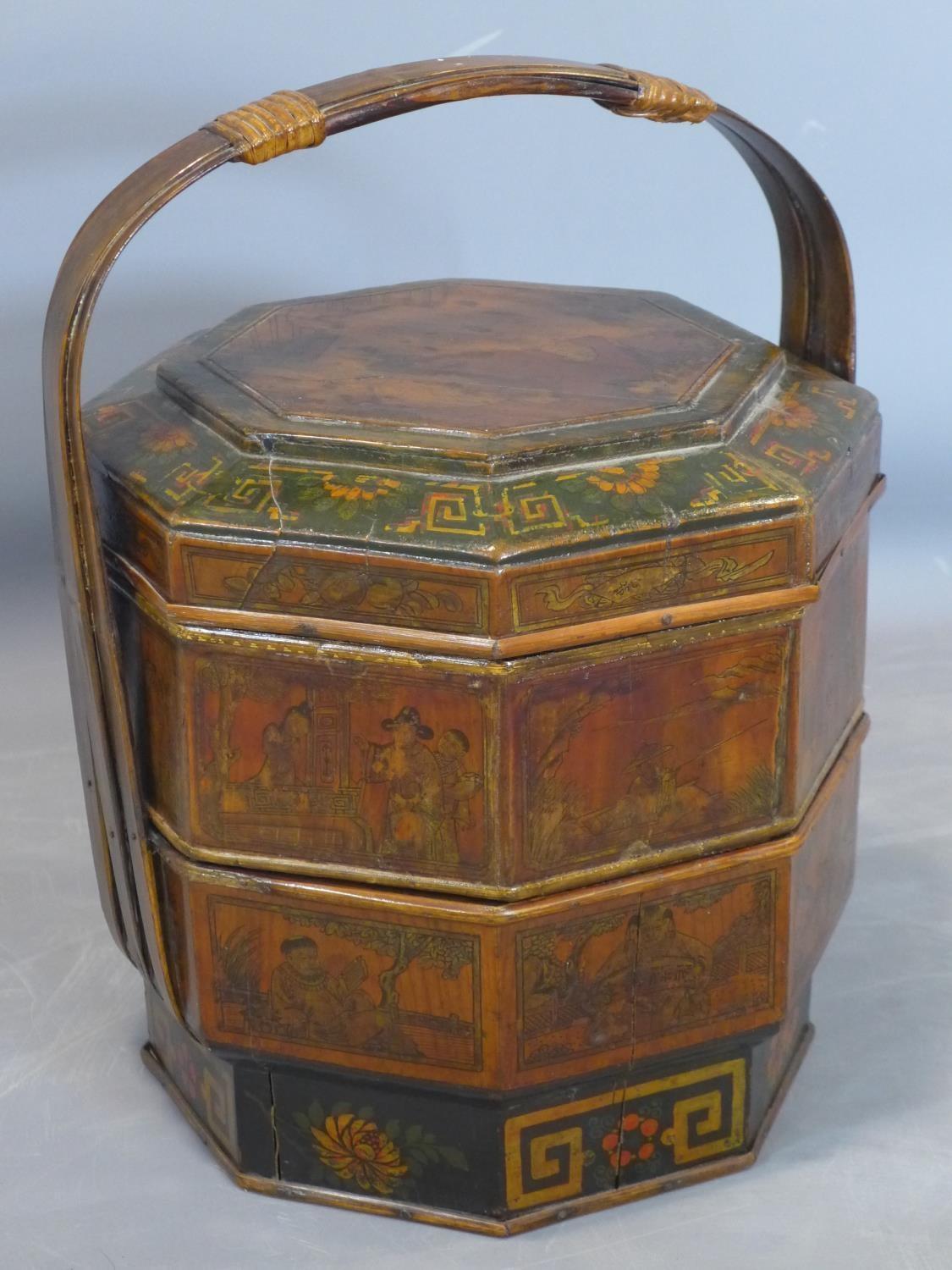 A late 19th century Qing Dynasty fir wood wedding cake box, decorated with panels depicting figures,