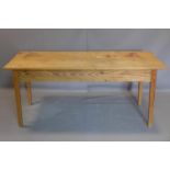 A 20th century pine table, H.79 W.183 D.76cm