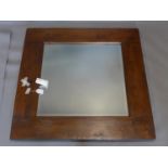 A Lombok square mirror, with bevelled glass plate, 101 x 101cm