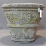 A large reconstituted stone garden pot, decorated with scrolling foliage, masks and palmettes, H.