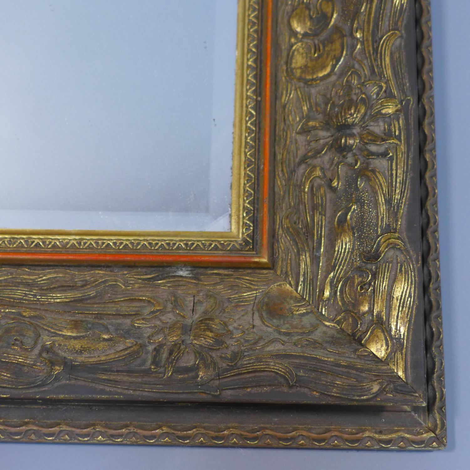 A giltwood mirror with floral border and bevelled plate, 78 x 100cm - Image 2 of 2