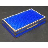 A silver and blue enamelled box, with gilt star design, having gilded interior, marked 925, H.2 W.10