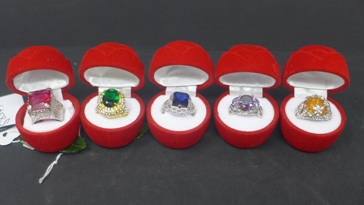 Five silver and gem set rings, each marked 925, each in boxes modelled as roses (5)