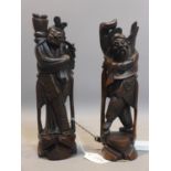 A pair of early 20th century Chinese carved hardwood figures with silver thread inlay H.29cm