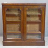 A Victorian mahogany glazed bookcase, raised on pedestal base, H.122 W.123 D.78cm