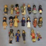 A collection of vintage dolls including examples representing countries around the world and various