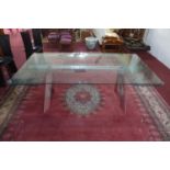 An Italian extending glass dining table by Naos, H.74 W.200 D.100cm (not extended)