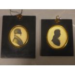 Two 19th century oval silhouette portraits of gentlemen, in ebonised frames, 7 x 6cm and 8 x 7cm (2)