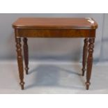 A 19th century mahogany foldover tea table on turned and barley twist legs, H.77 W.89 D.91cm