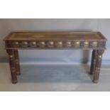 An Anglo-Indian hardwood console table, with floral decorated brass inlaid frieze to top, floral