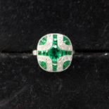 A platinum Art Deco style emerald and diamond panel ring, approx. size N