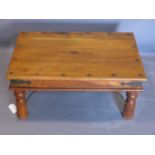 An Indian teak coffee table. H41 W.90 D.60cm