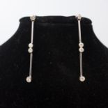 A pair of 18ct white gold drop earrings set with diamonds, boxed
