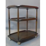 A mid 20th century Ercol three tier trolley, raised on castors, H.78 W.72 D.47cm