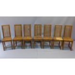 A set of seven late 19th century oak chairs, raised on square chamfered legs (7)