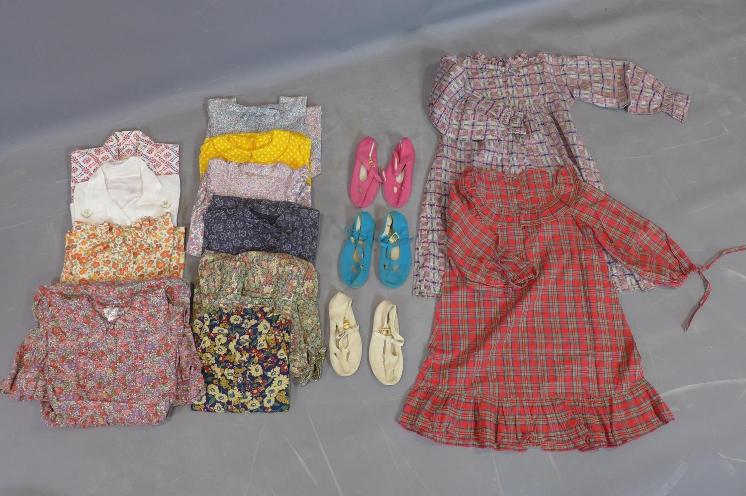 A vintage hatbox containing 12 items of 1970's girls dresses and tops, including Laura Ashley and