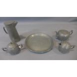 A Chinese pewter tea set, to include a teapot, hot water pot, jug, twin handled sugar pot and