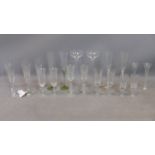 A collection of 10 pairs of glass and crystal champagne glasses, to include a pair of John Rocha