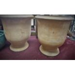 A pair of fired clay Provence urn style planters, H.50cm Diameter 45cm