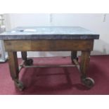 A 20th century Industrial style zinc top table, raised on wrought iron castors, H.49 W.74 D.56cm