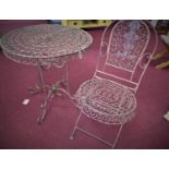 A metal garden table, with pierced scrolling decoration, on scrolling supports, H.76cm Diameter