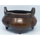 A Chinese bronze incense burner, with seal mark to base, H.10 W.16cm