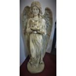 A large cast plaster statue of an angel holding a bird, on circular base, H.121cm