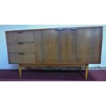 A mid 20th century sideboard by Hille, London, bearing label, having three short drawers and two