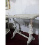 A 20th century white painted side table, on turned supports and outswept feet, H.70 W.86 D.43cm
