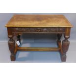A Victorian oak centre table with one drawer, having carved frieze panels, on baluster supports