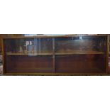 A mid 20th century glazed bookcase by Hille, London, with two sliding doors, on tapering legs,