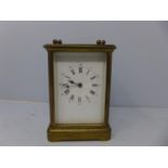 An early 20th century French brass carriage clock by Richard & Cie, the white dial with Roman