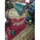 A vintage green metal anglepoise lamp