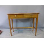 A 20th century side table with two short drawers, on square tapered legs joined by stretcher, H.76