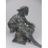 A cast metal figure of a man in 17th century attire seated on a column base, H.34cm