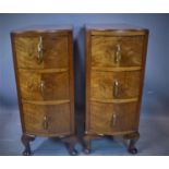 A pair of Art Deco walnut bow fronted pedestal chests of three drawers, with Bakelite mounted