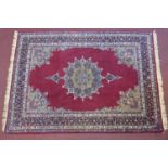 An antique Persian Kirman rug of Safavi design, central floral medallion and floral spandrels on a