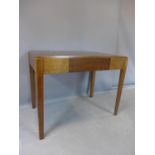 An oak desk, stamped AM, with single drawer, raised on square tapered legs, 77x99x61cm (H-W-D)