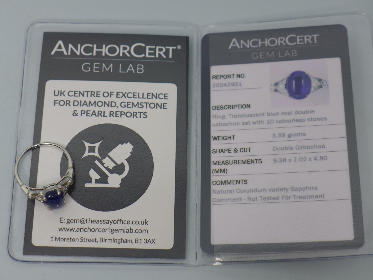 A platinum ring set with translucent blue oval double cabochon sapphire and 10 colourless - Image 5 of 5