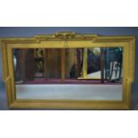 A 19th century giltwood mirror, with out-stepped frame and floral pediment, 47 x 77cm