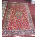 A Persian Tabriz carpet, central floral medallion with bird and floral motifs on a pink ground,
