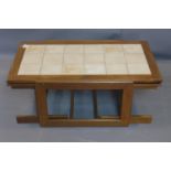 A mid 20th century teak nest of three tile top tables, to include coffee table, H.40 W.103 D.63cm,