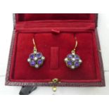 A pair of drop earrings set with amethysts and diamonds, boxed