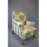 A Victorian beech framed armchair in modern floral and striped upholstery.